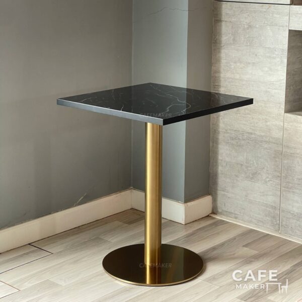 Isometric view of a black marble table featuring elegant golden leg, highlighting its sophisticated design