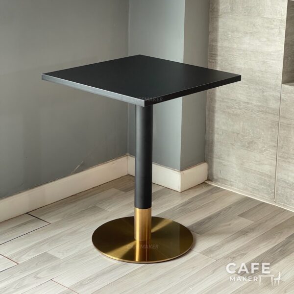 Isometric view of a black top table with black and golden leg