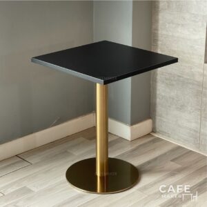 Isometric view of a black top table with elegant golden legs