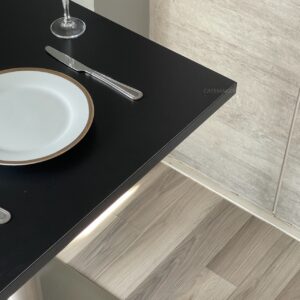 Top view of black top table with metal leg