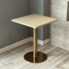 Isometric view of a parawood top table featuring elegant golden leg
