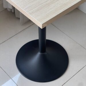 Base of a parawood top table featuring round leg, highlighting its sturdy construction and design