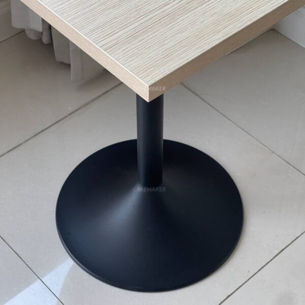 Base of a parawood top table featuring round leg, highlighting its sturdy construction and design