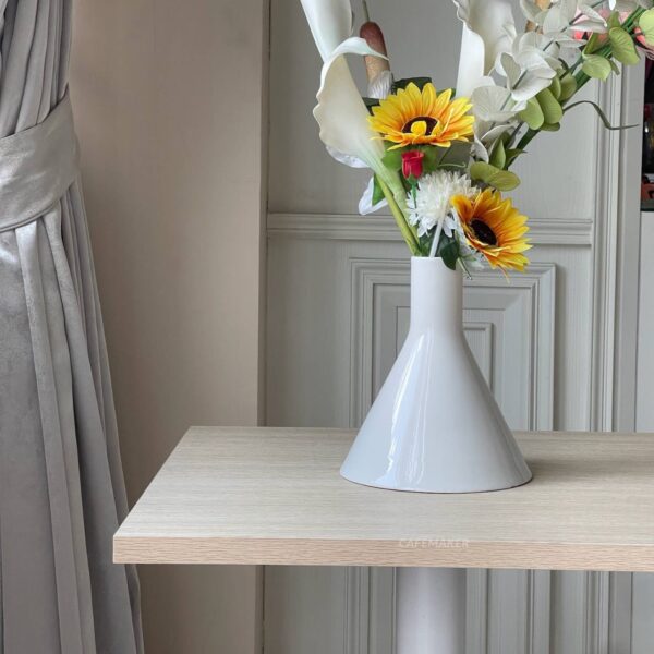 Parawood top table with square white leg, beautifully adorned with a flower arrangement on top