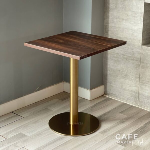 Isometric view of a walnut top table featuring elegant golden leg