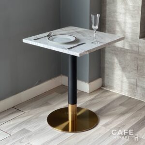 white marble table with black and gold leg, elegantly styled with a complete dining set