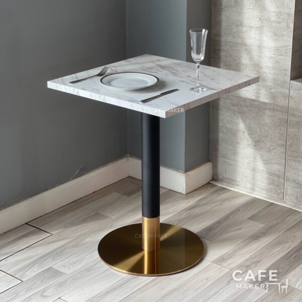 white marble table with black and gold leg, elegantly styled with a complete dining set