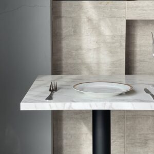 White marble table with black and golden leg, top side view