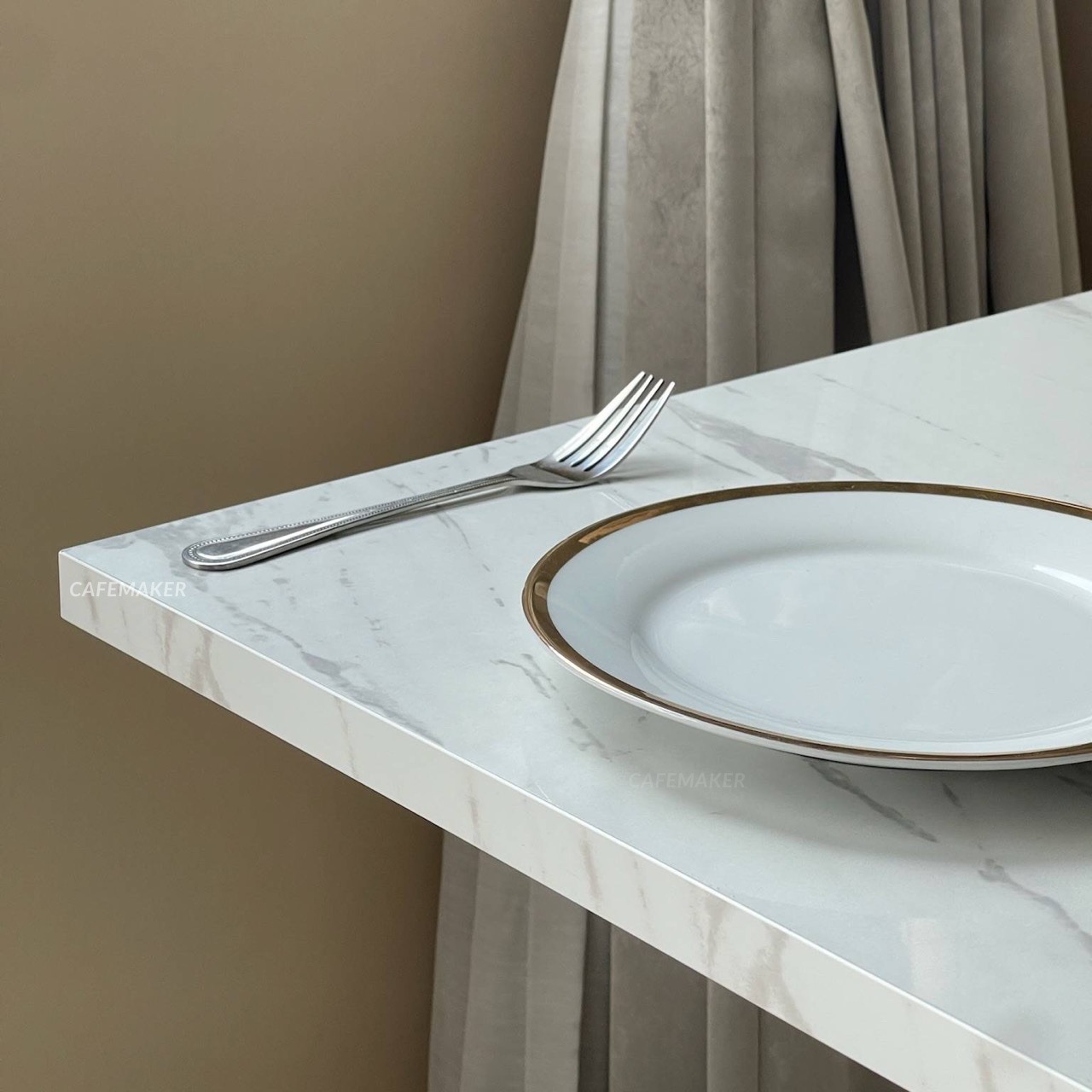 Close-up of white marble table with square white leg