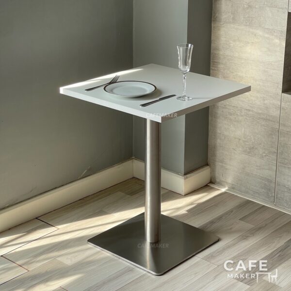 White top table with square metal leg styled with dining set
