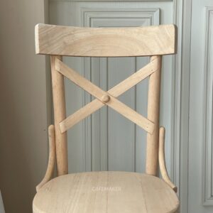 Front view of a narrow natural parawood Windsor chair, showcasing its elegant design and natural wood grain