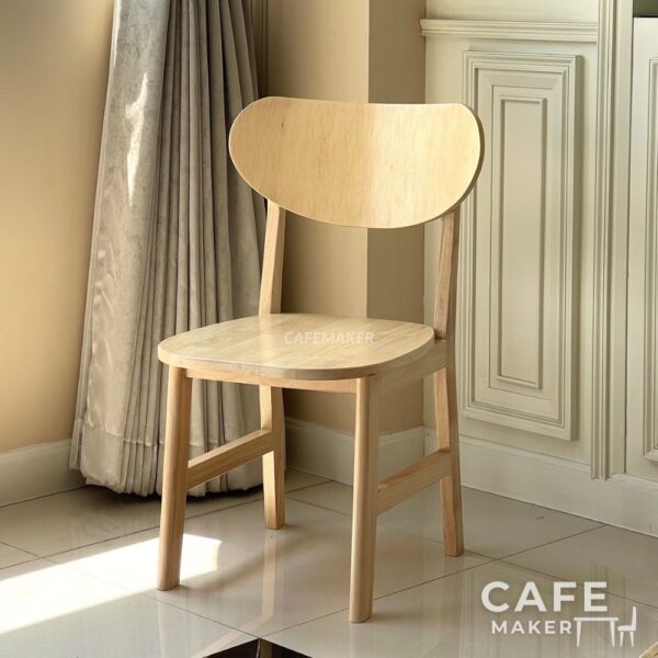 Isometric view of a natural parawood café chair with a C-Curved backrest
