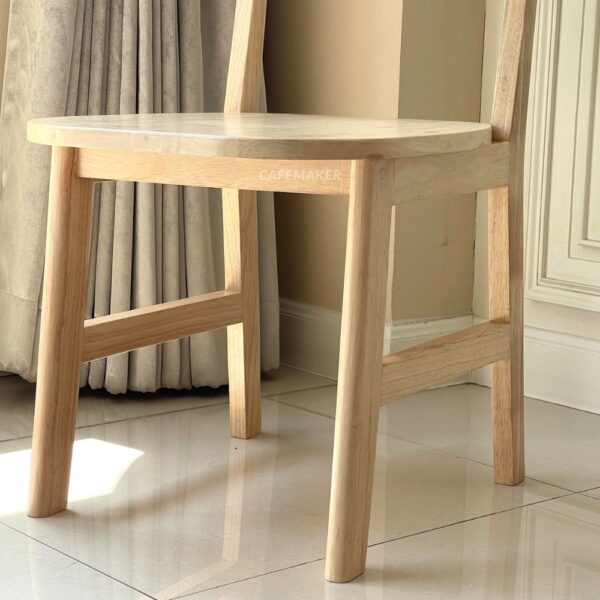 Natural parawood café chair featuring a C-curved backrest and seat
