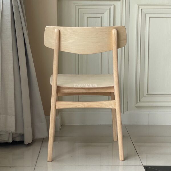 Back view of a natural parawood café chair featuring a V-backrest