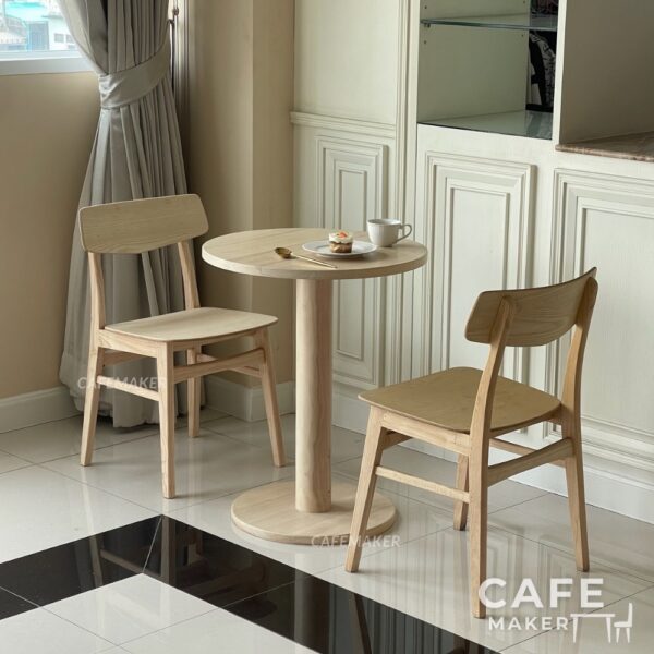 Natural parawood café chair with a V-backrest displayed in a set sample arrangement