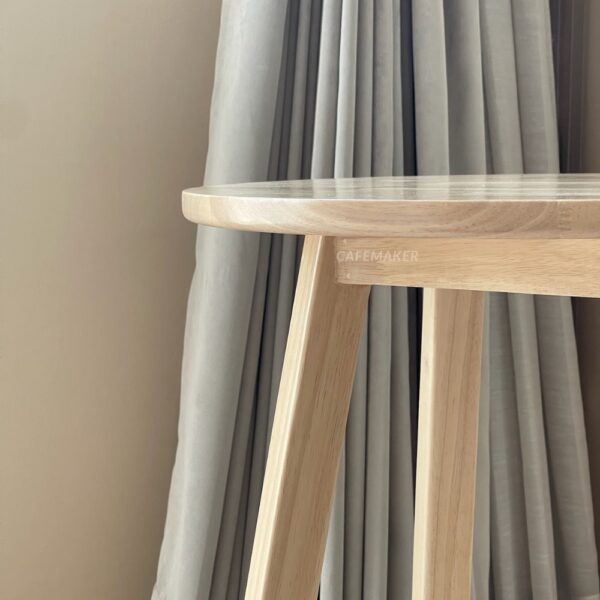 Close-up view of a natural parawood farm table