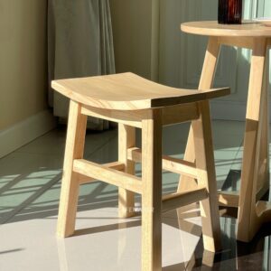 Close-up view of a natural parawood rectangle stool set