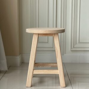 Front view of a natural parawood round stool chair
