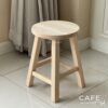 Isometric view of a natural parawood round stool chair