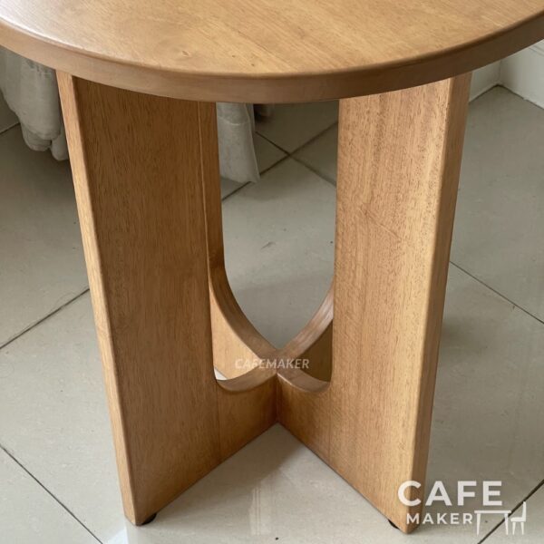 Close-up view of a natural parawood side table