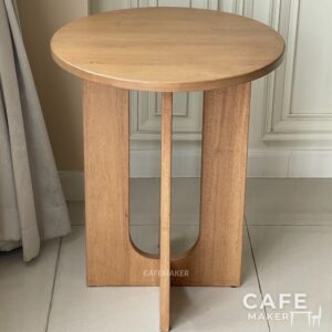 Front view of a natural parawood side table