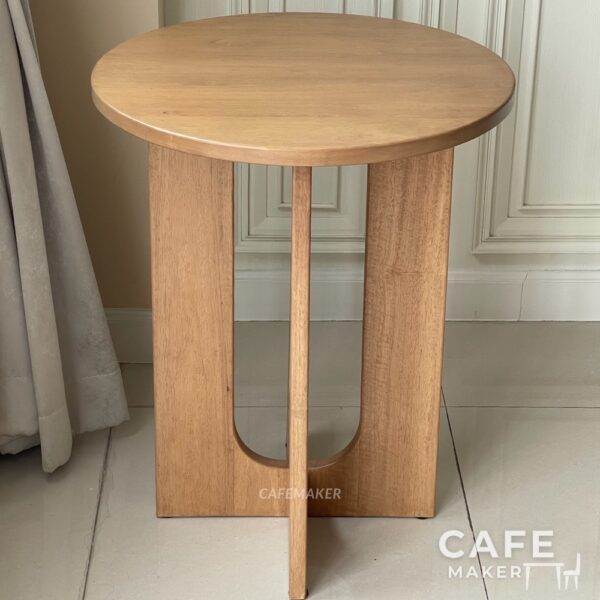 Front view of a natural parawood side table