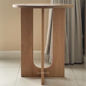 Side view of a natural parawood side table
