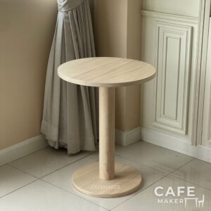 Isometric view of a natural round parawood coffee table
