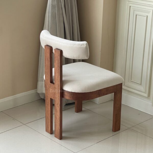 Back isometric view of a parawood dining chair with a white cushioned seat
