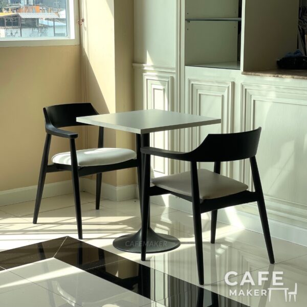 Set of black parawood side chairs with thick backrests