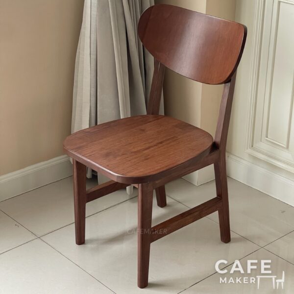 Isometric view of a walnut parawood café chair with a C-curved backrest