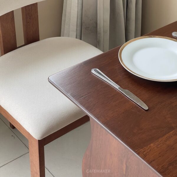 Close-up view of a walnut parawood café set