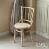 Isometric view of a wide natural parawood Windsor chair, showcasing its classic design and natural wood finish