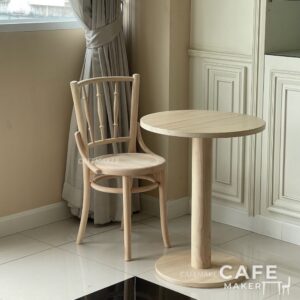 Set of wide natural parawood Windsor chairs arranged together, highlighting their classic design and natural wood finish