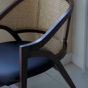 Close-up view of a black parawood rattan chair