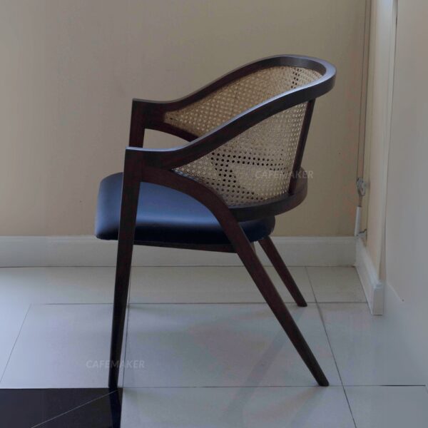Side view of a black parawood rattan chair