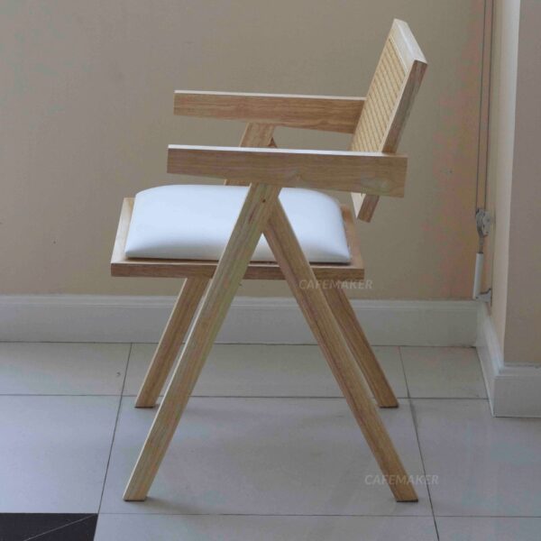 Side view of a natural parawood rattan chair