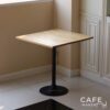 Isometric view of an oak top table with champagne leg