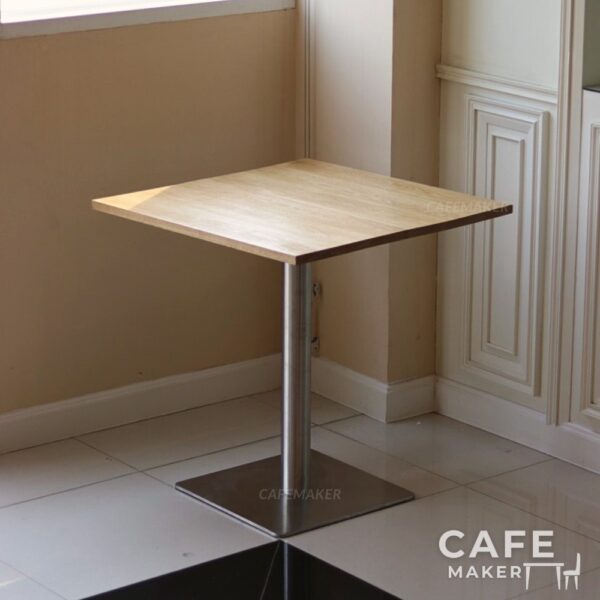 Isometric view of an oak top table with square metal leg
