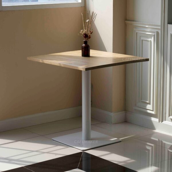 Oak top table with white square leg and a flower decoration