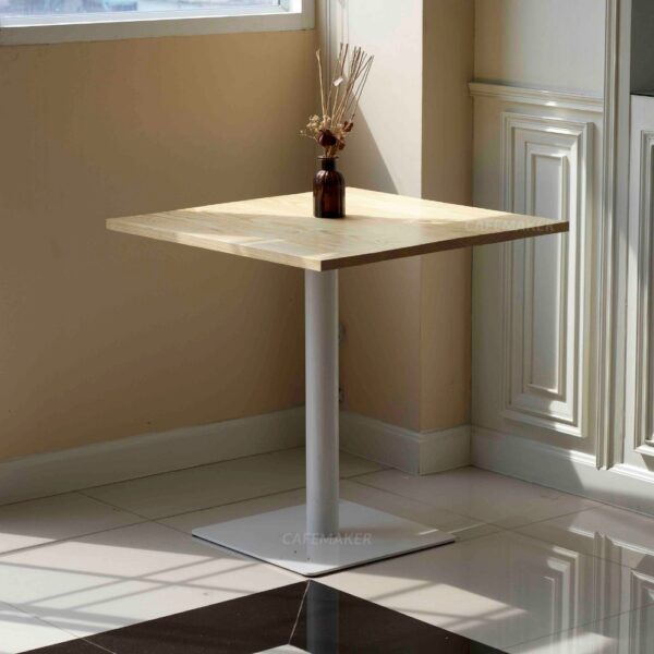 Pine top table with white square leg and a flower decoration