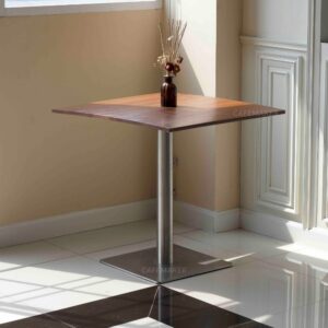 Shorea wood top table with square metal leg, decorated with a flower decoration