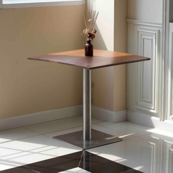 Shorea wood top table with square metal leg, decorated with a flower decoration