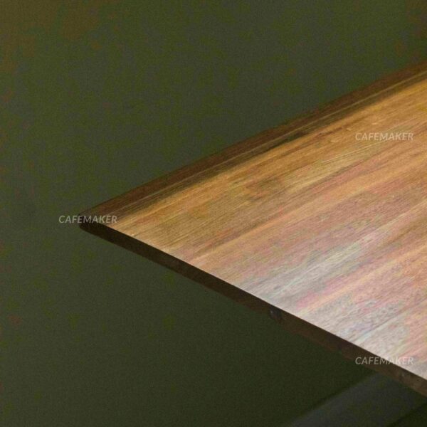 Close-up of a table with a Shorea wood top and white square leg