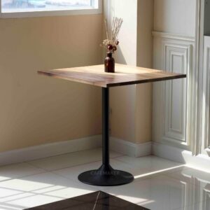 Walnut top table with champagne leg and a flower decoration