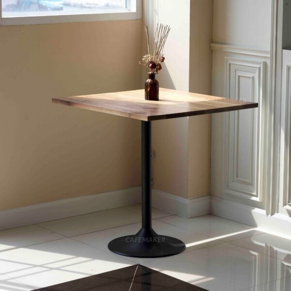Walnut top table with champagne leg and a flower decoration