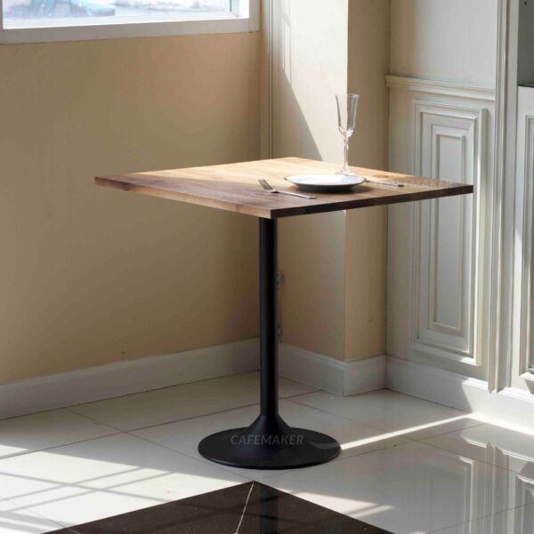 Walnut top table with champagne leg used as a prop