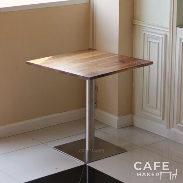 Isometric view of a walnut top table with square metal leg