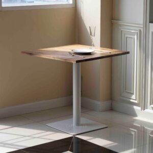Walnut top table with white square leg used as a prop
