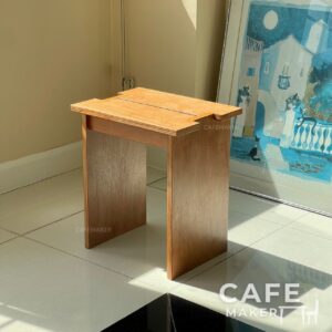 isometric view of backless natural plywood chair with rectangular seat